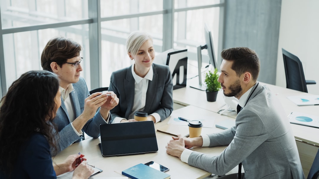 Consulting team discussing relationship strategy in modern office